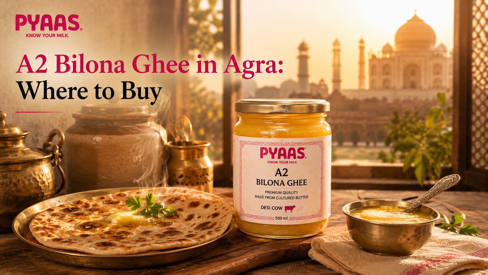 A PYAAS A2 Bilona ghee jar on a wooden table beside a fresh paratha and a spoonful of ghee.